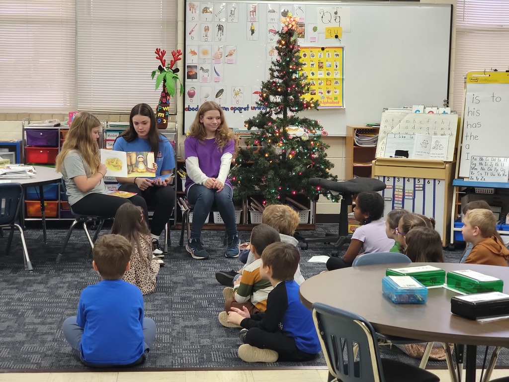 middle school kids with kindergarten students