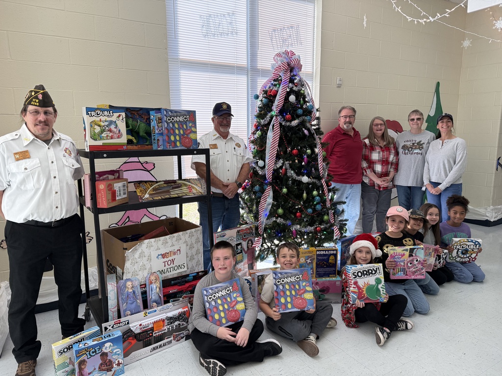 VFW members with kids and Christmas gift donations