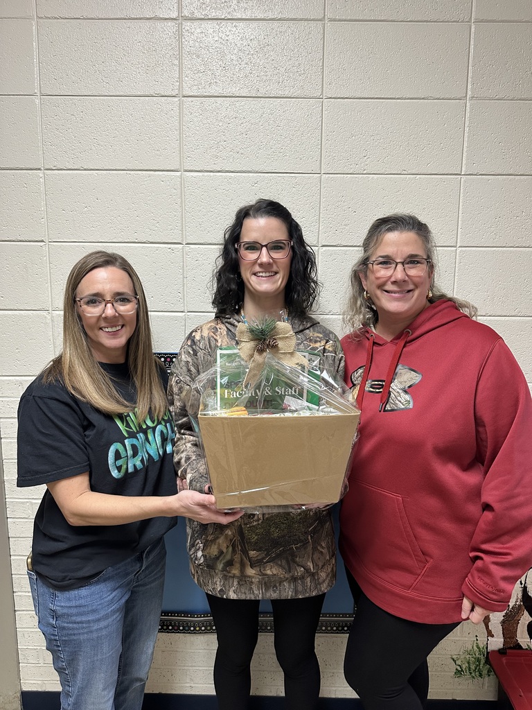 3 teachers holding gift basket