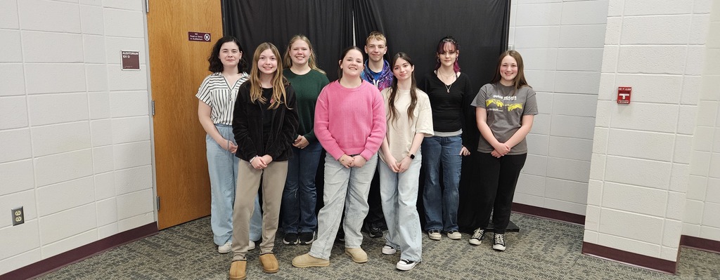 JH kids posing in front of backdrop