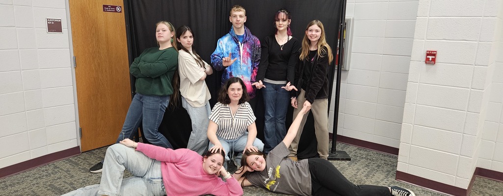 JH kids posing in front of backdrop