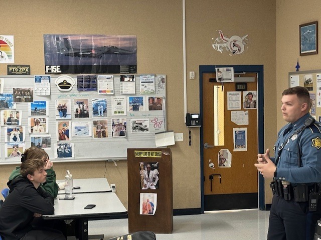 Cop presenting to students