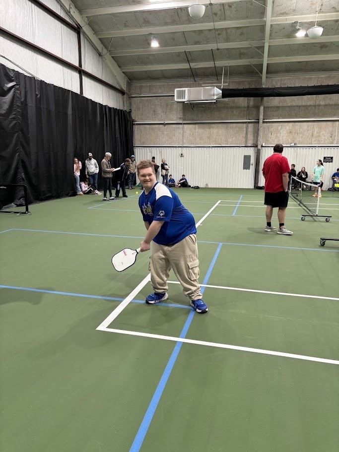 kid playing pickleball