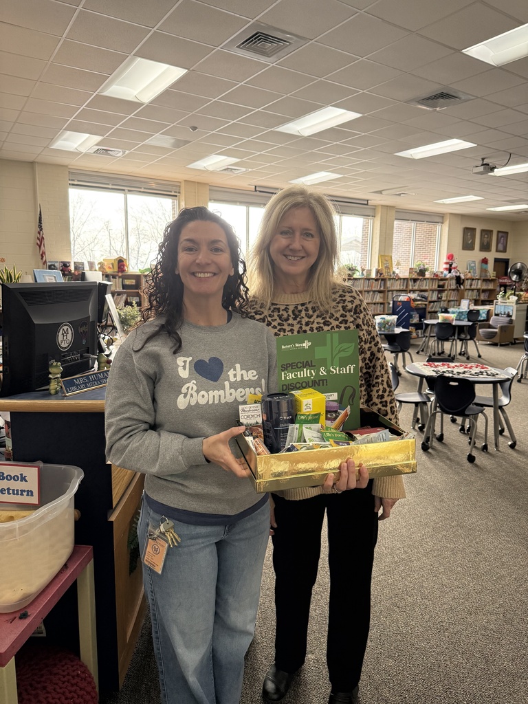 teachers holding goodie basket