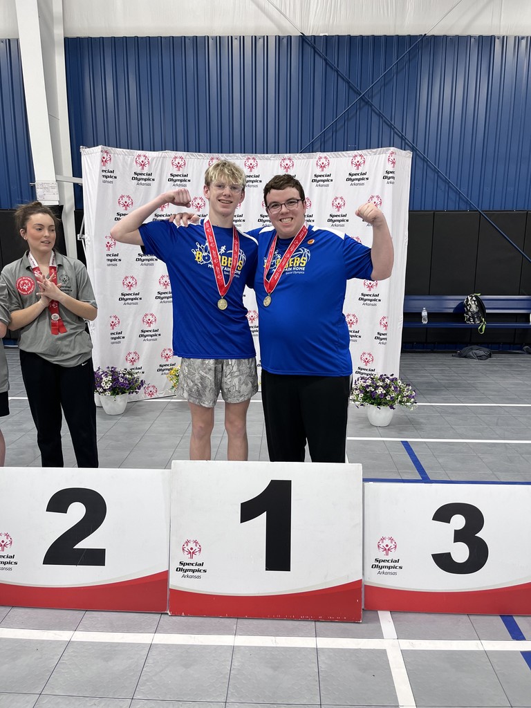 kids posing with medals