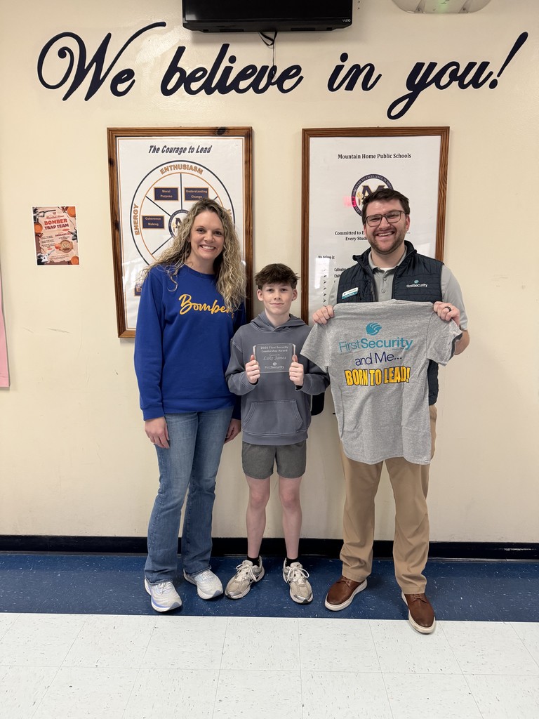 Luke posing with principal and rep from FSB