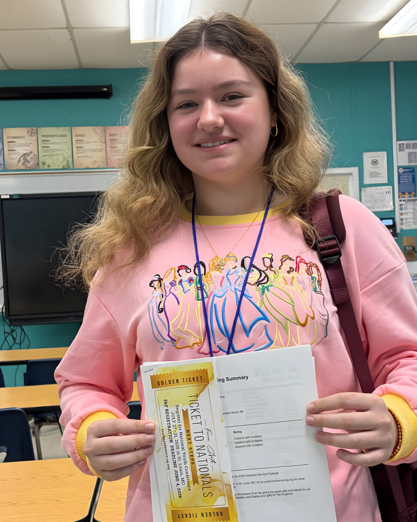 Student holding an invitation to a National Youth Conference.  