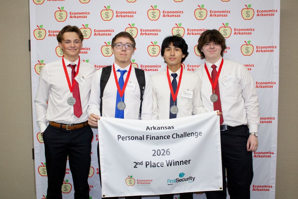 four boys with 2nd place banner. 