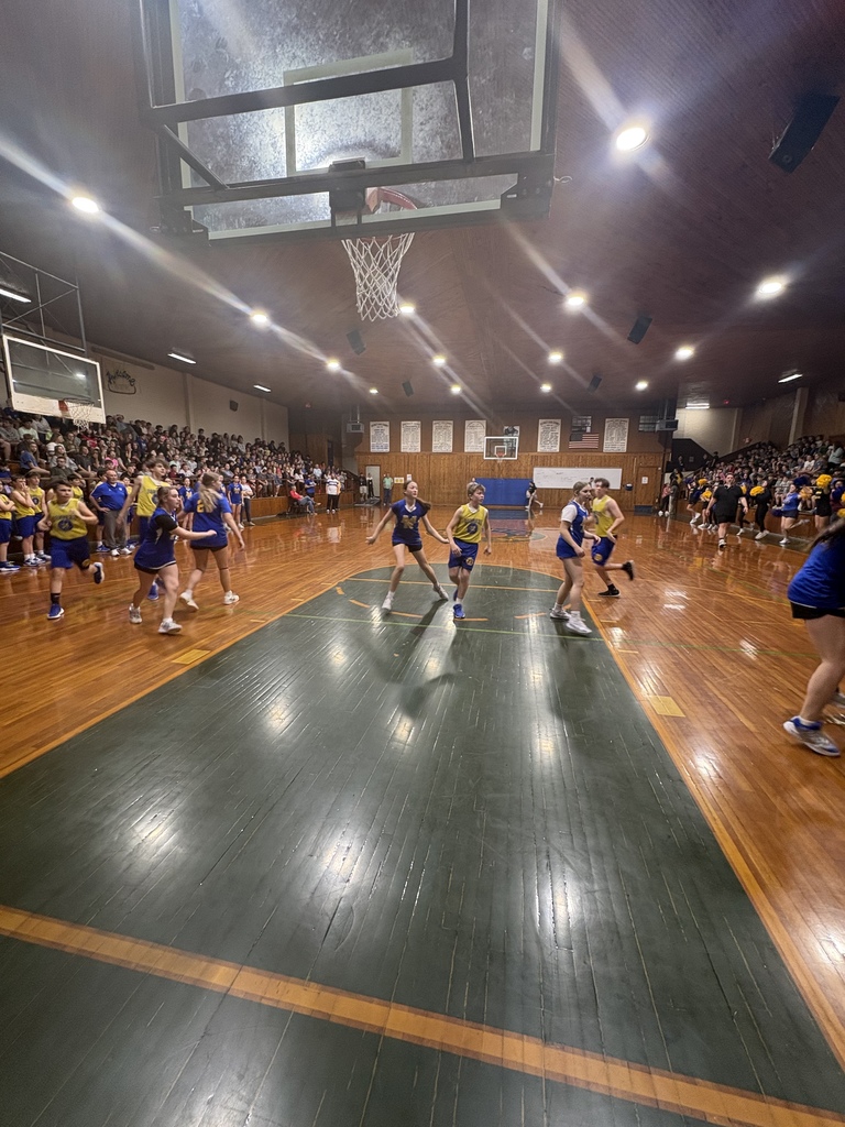 players running around the court during the basketball game