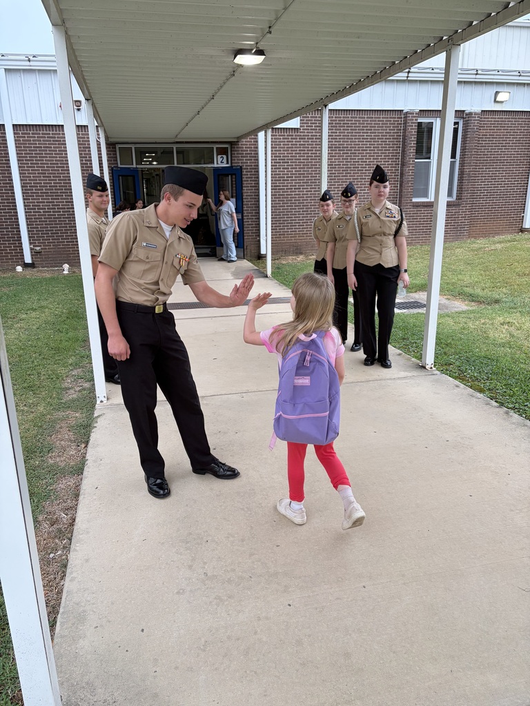 NJROTC Cadets greeting our NWH students at car line this morning. 