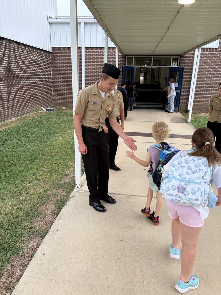 NJROTC Cadets greeting our NWH students at car line this morning. 