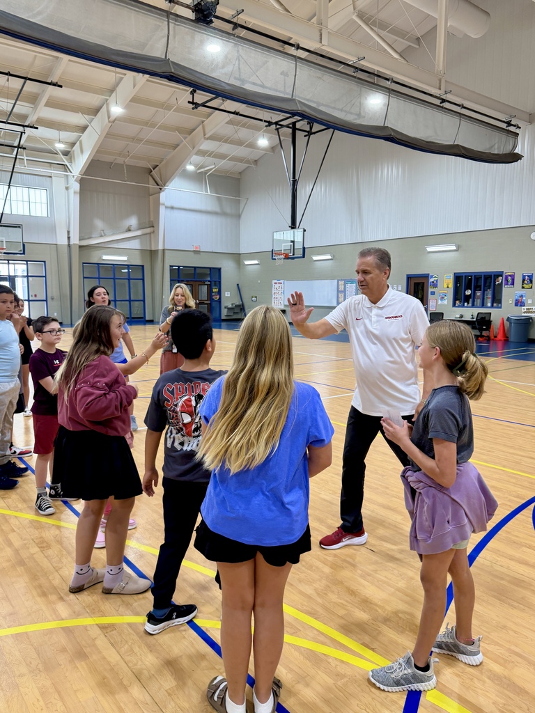 Coach John Calipari congratulating students on a winning video