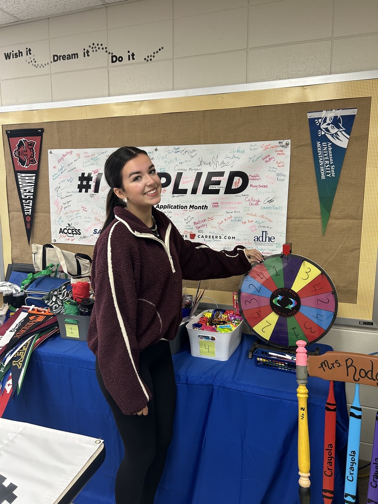 female student spinning a wheel