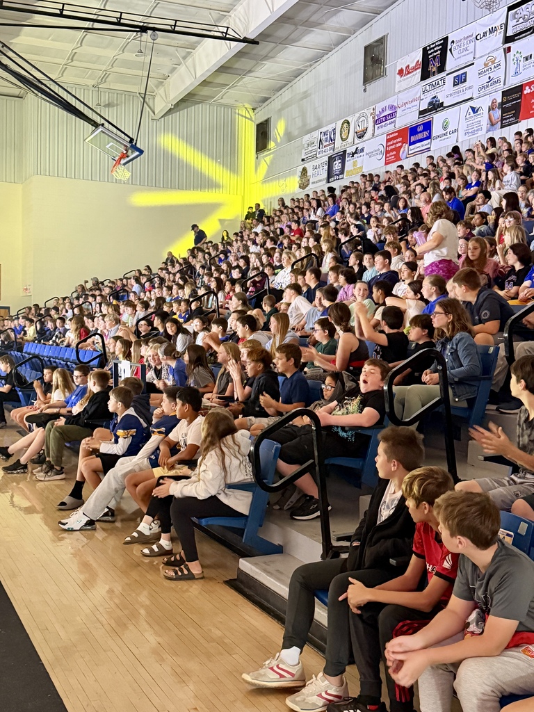 Students in bleachers at FIRST Robotics Competition Ozark Mountain Brawl