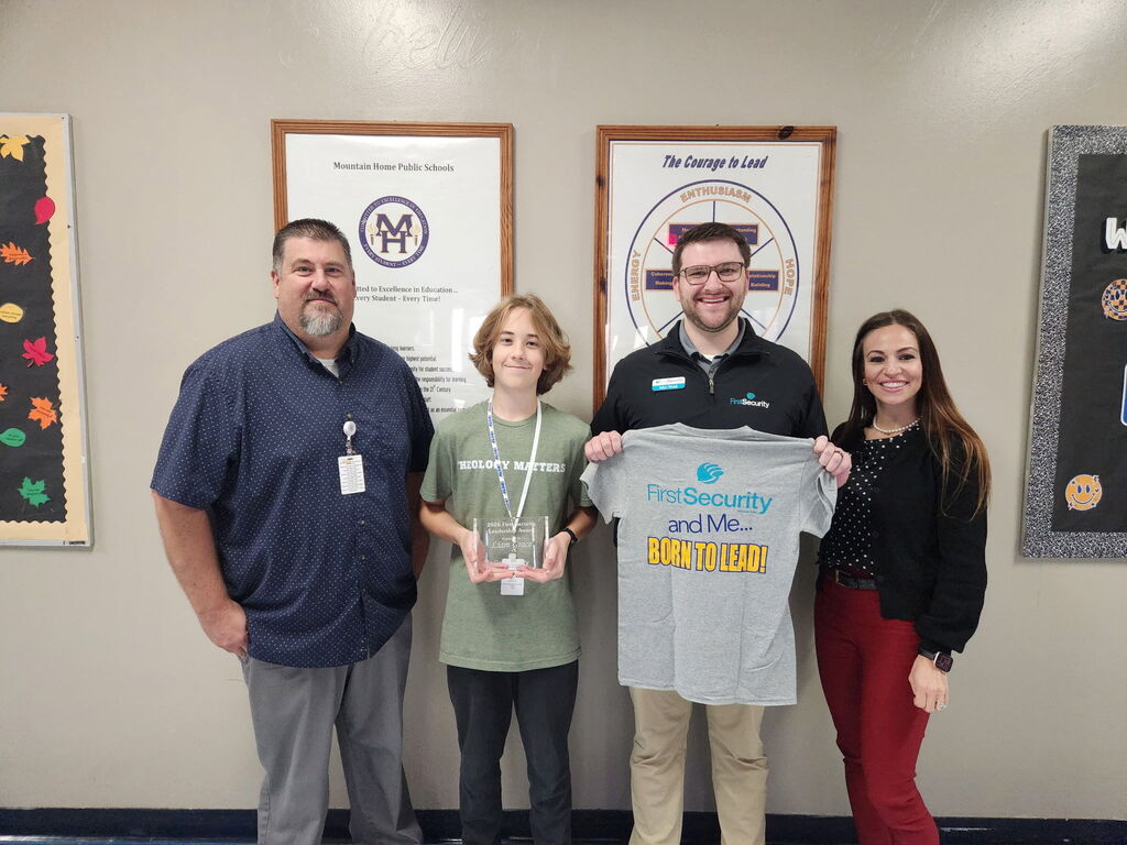 9th Grader Liam Grace with MHJH Assistant Principal Tom Ethridge & First Security Bank Employees