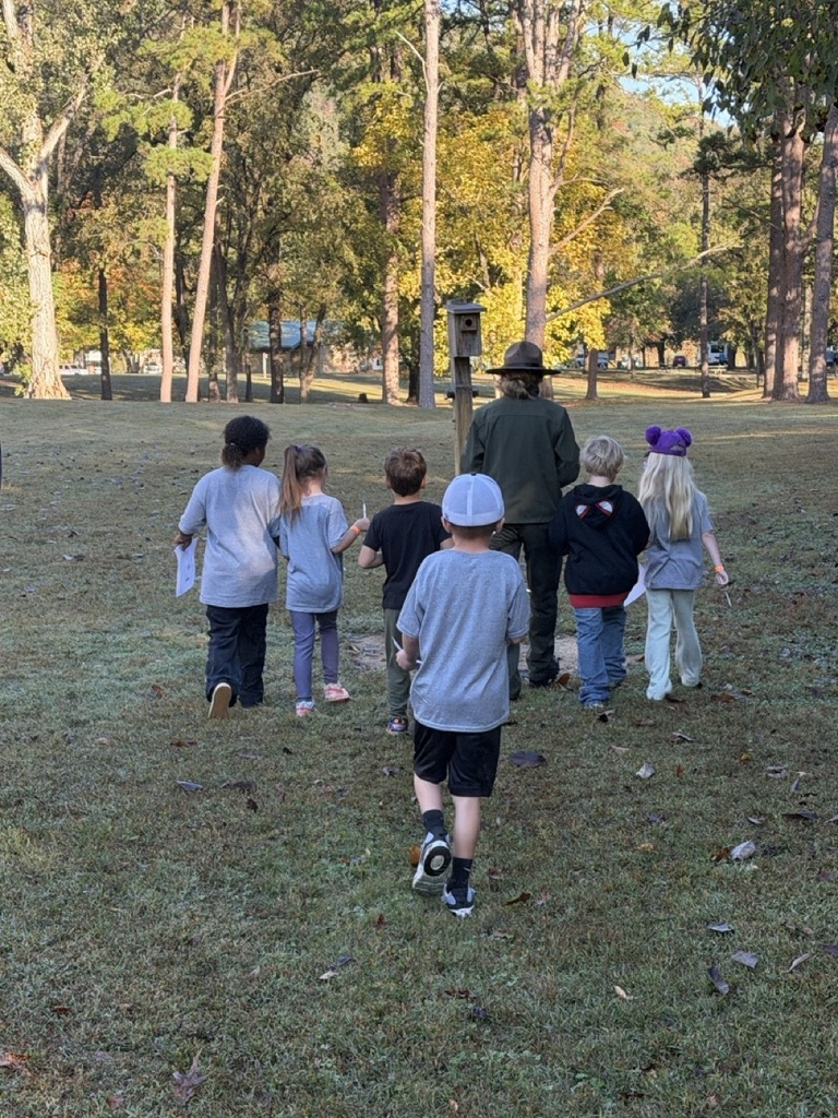 NHW students walking with a park ranger at the state park