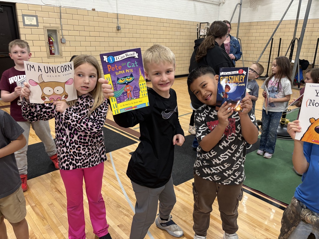 Students showing their books