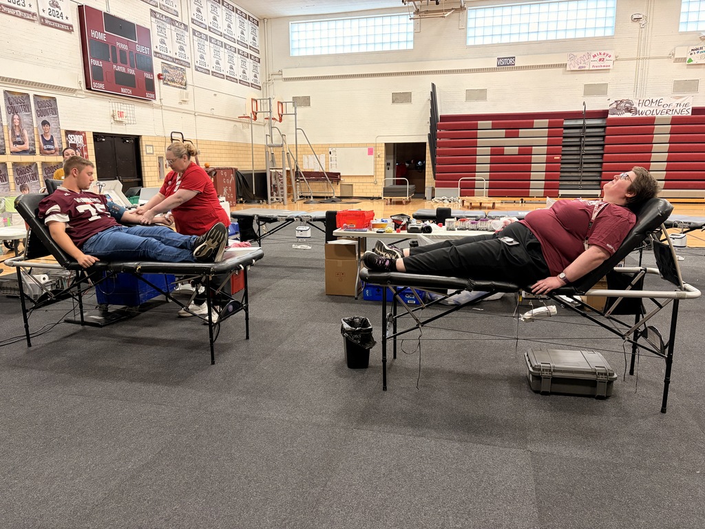Logan and Ms. Peters donating blood