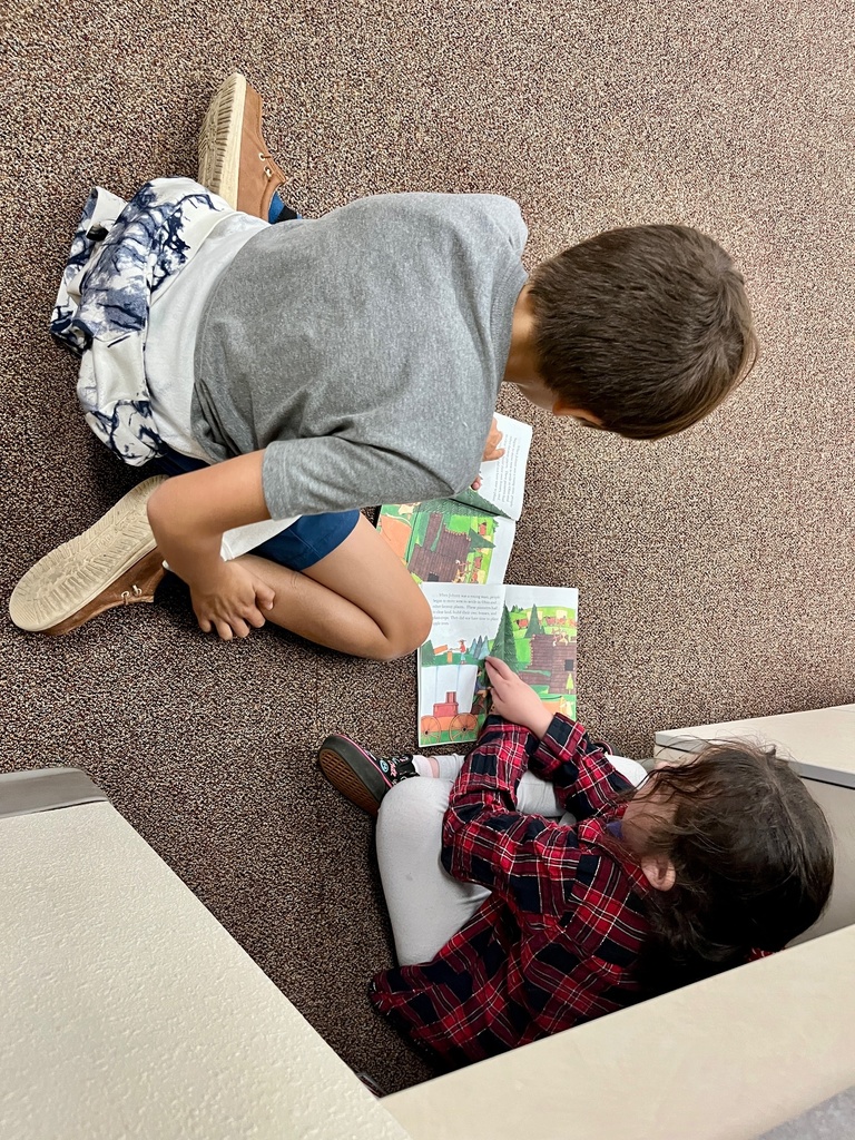 Students reading together.