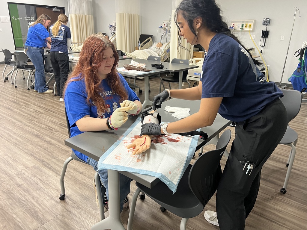 Student learning how to put on a tourniquet