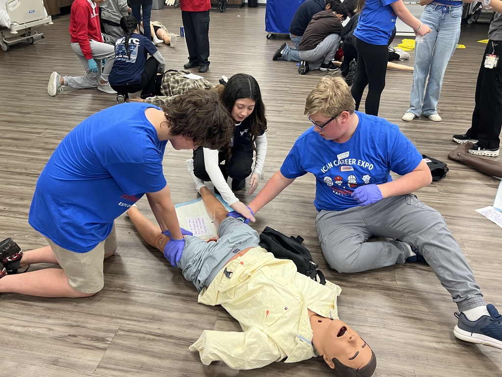 Students working together to learn about becoming an EMT