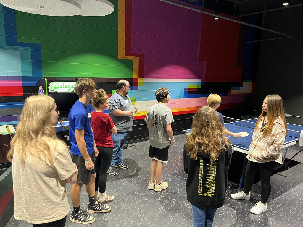 Students touring ArcBest and looking at one of their break rooms.