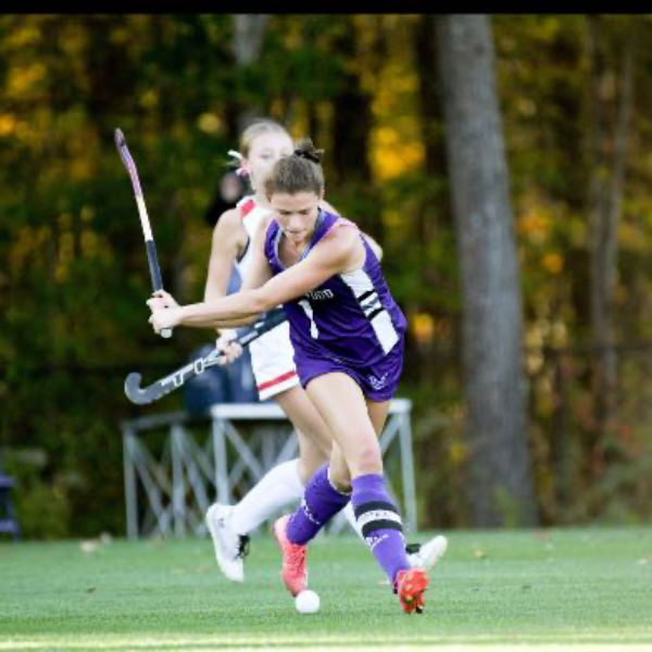 Hazel Stout playing field hockey 