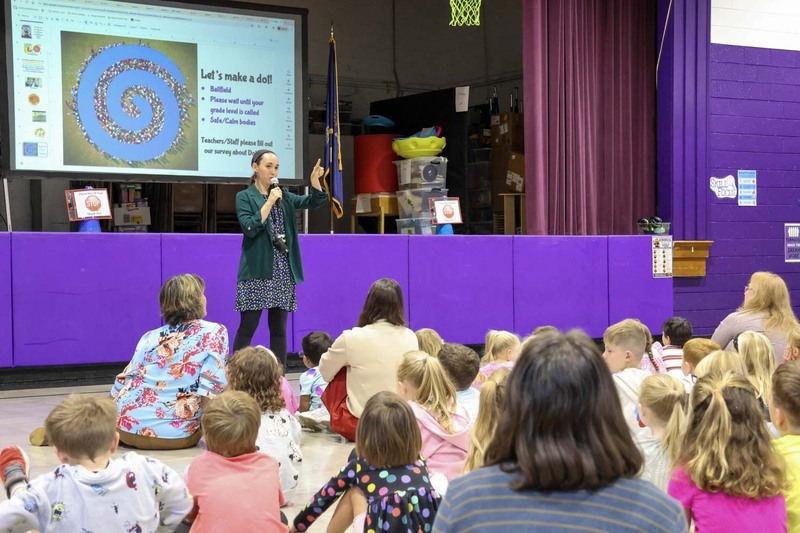 Michele Ma leads the students in a Dot Day Assembly at Eliot Elementary School on Sept 15, 2026