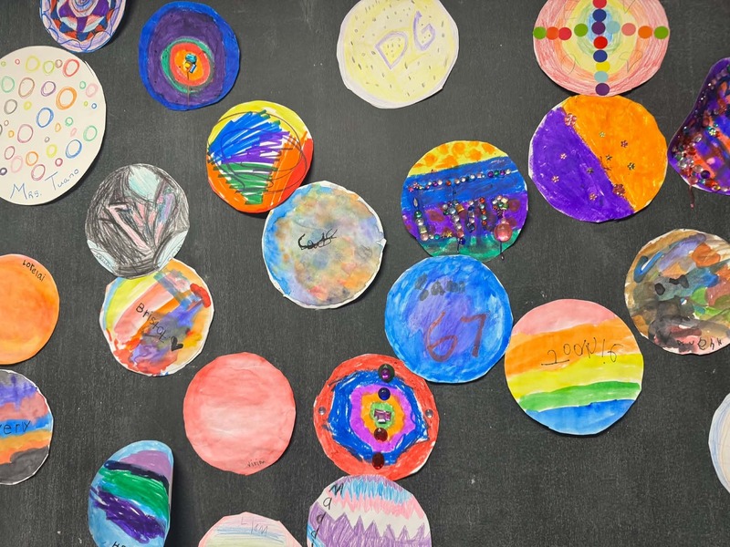 Student-made dots hang on the wall of Eliot Elementary School to celebrate Dot Day on Sept 15, 2026