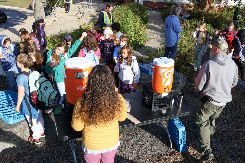 Students at the Jerry Burnell Great Works School enjoy lemonade and hot choclate after walking to school as a part of the monthly walk to school day.