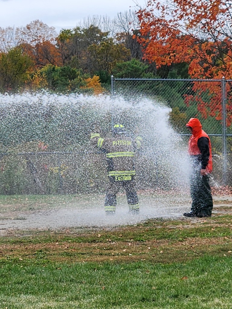 Dr Drolet being sprayed