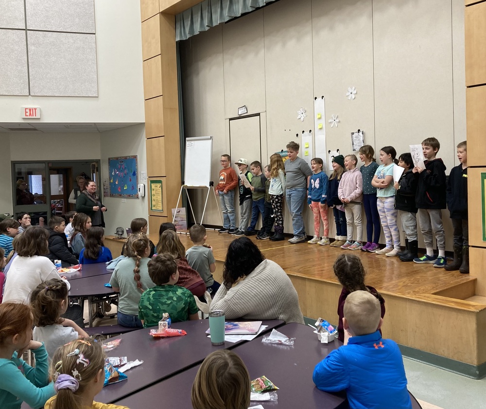 students singing on stage