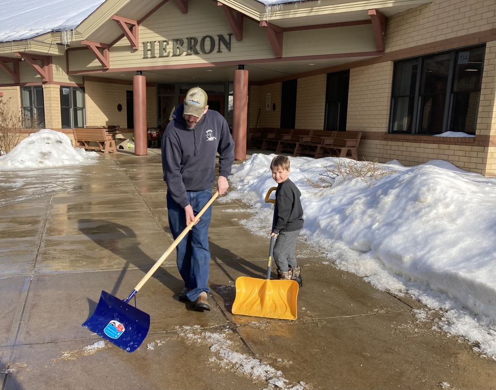 Volunteers shoveling ice