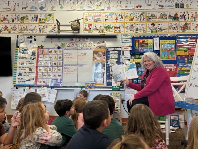 Ms. Manchester reading to Ms. Craib's class