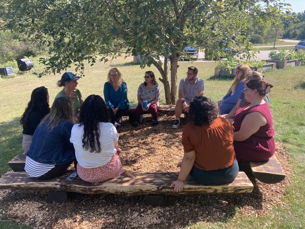 staff members sitting in a circle