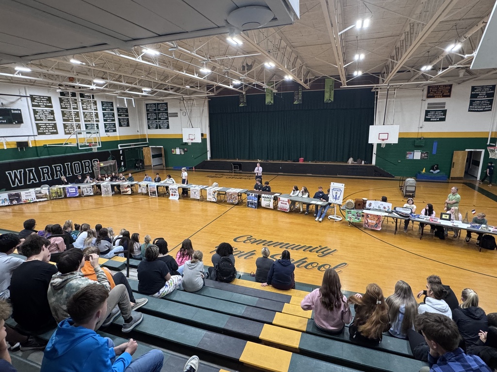 Students in the gymnasium listening to each club describe their purpose and goals.