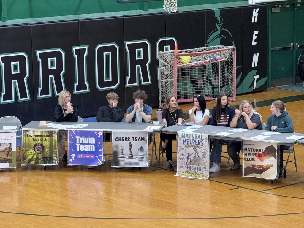 Students in the gymnasium listening to each club describe their purpose and goals.