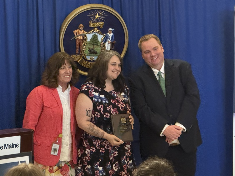 Gina receiving her award