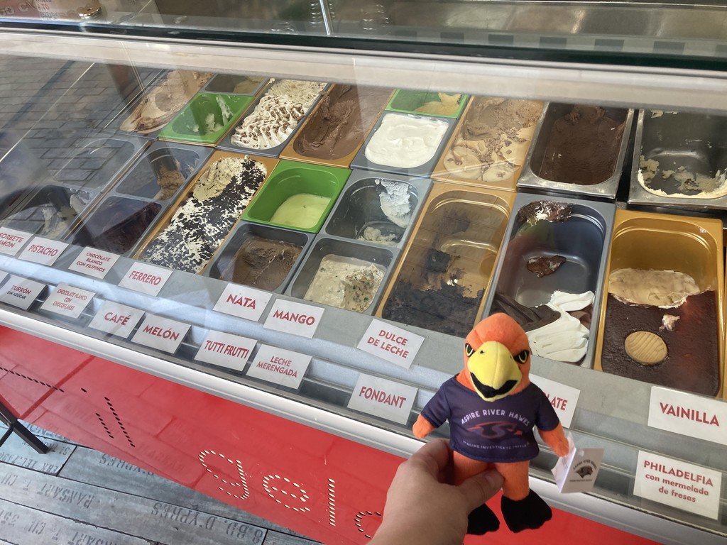 River Hawk plushie in front of Gelato flavors