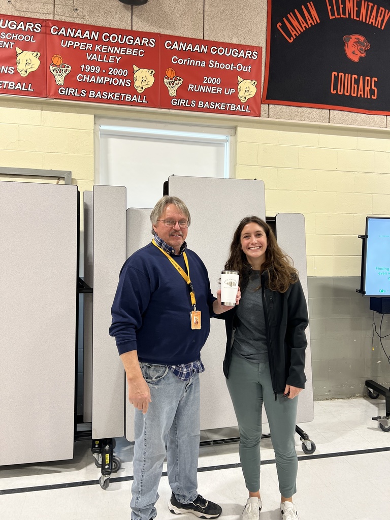 custodian receiving award in cafeteria