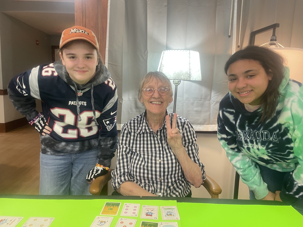 Students posing with resident.