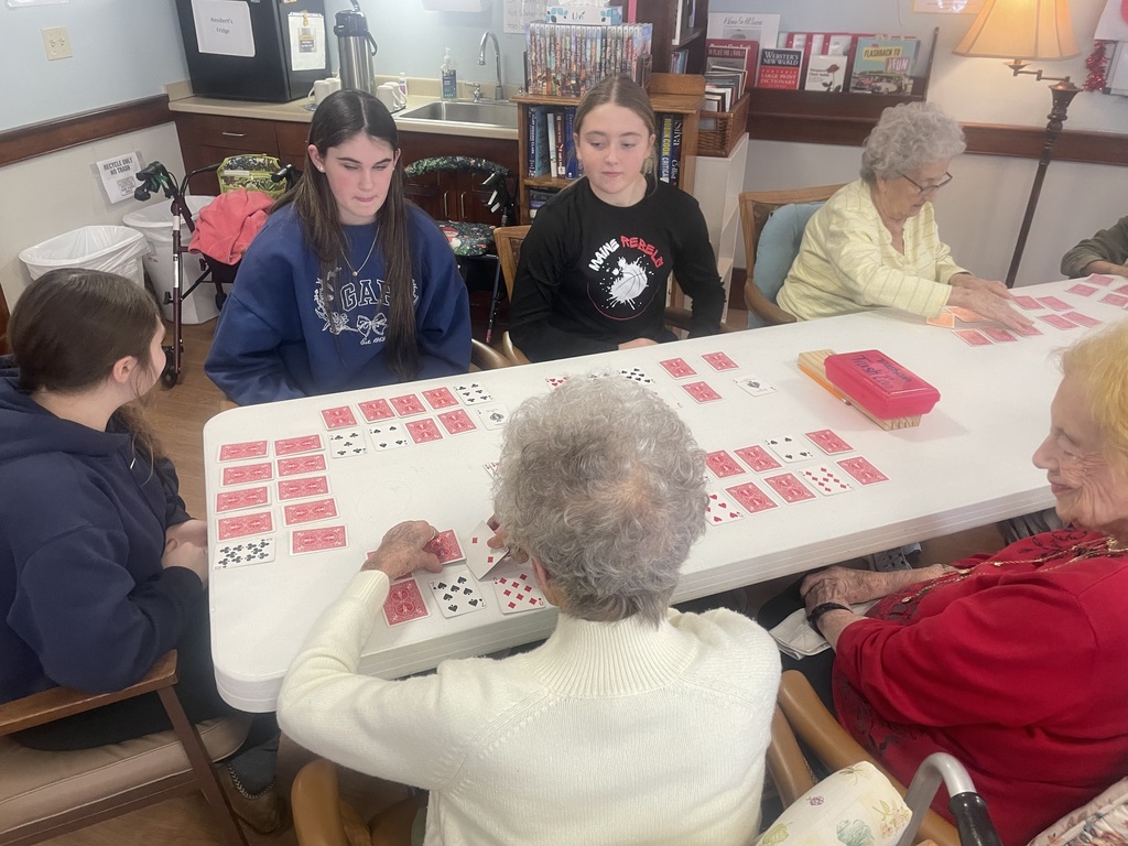 Students and residents playing cards.
