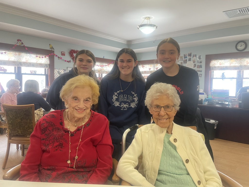 Students posing with residents.