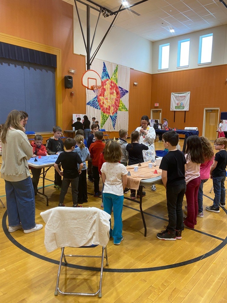 Students gathered around tables.