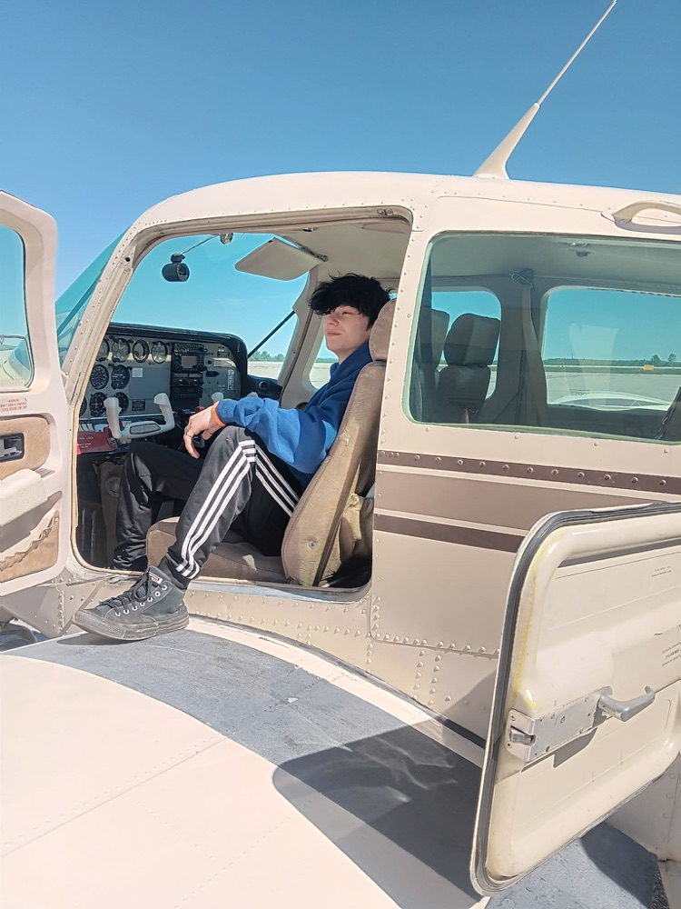 another student in the cock pit of a small plane