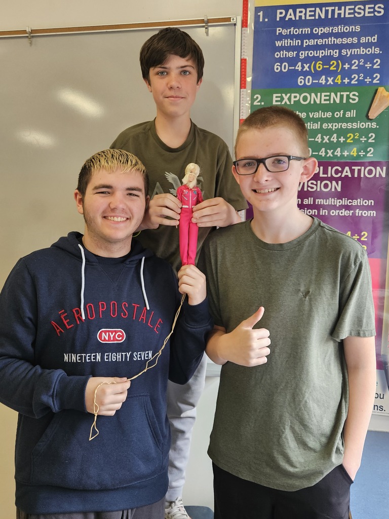 Students with a Barbie Bungee figure.