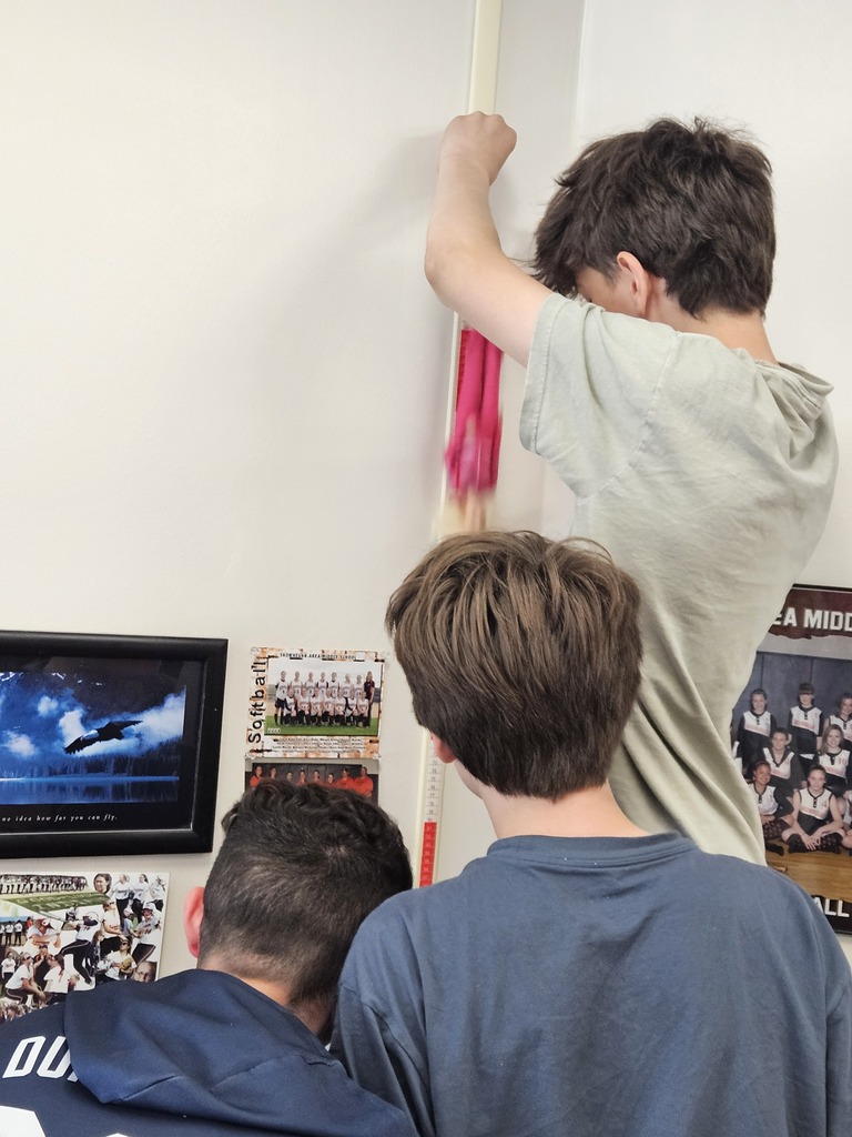 Students measuring a Barbie Bungee starting point.