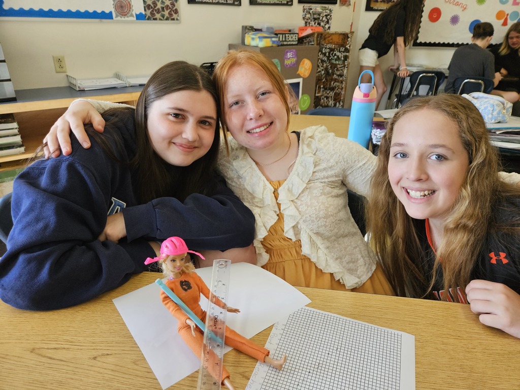 Students with a Barbie Bungee figure.