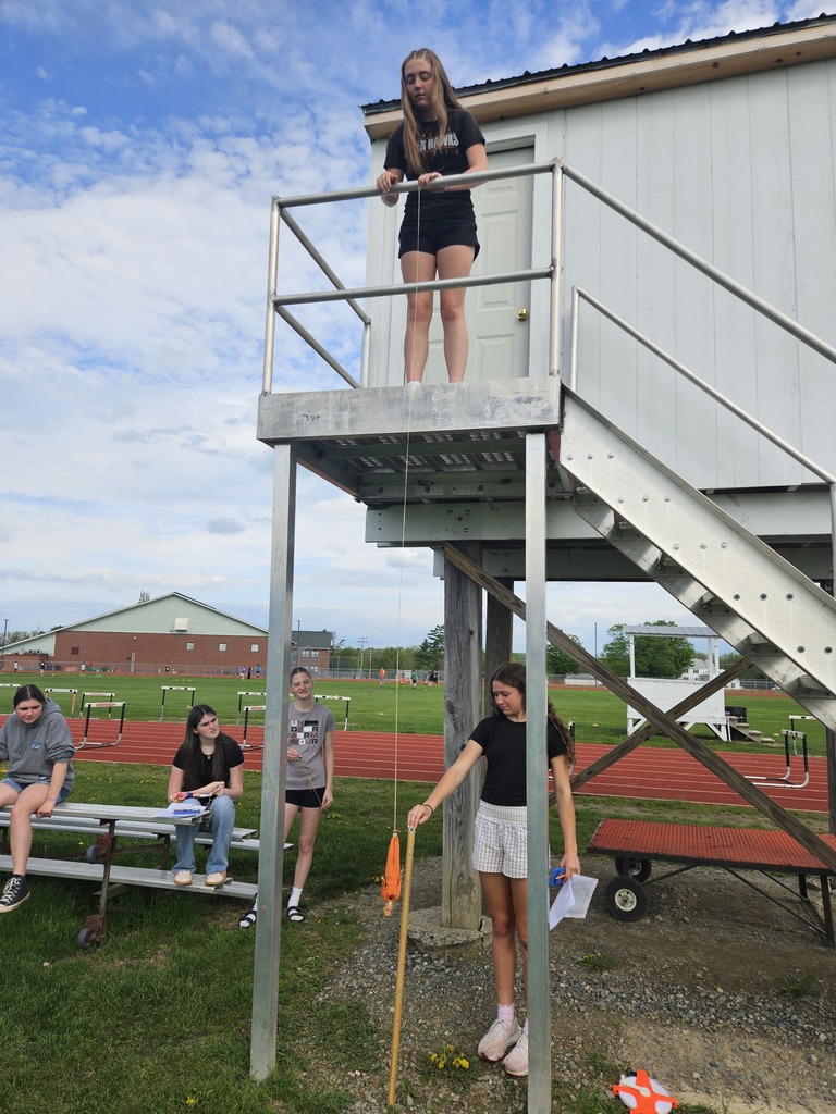 Students measuring a Barbie Bungee end point.