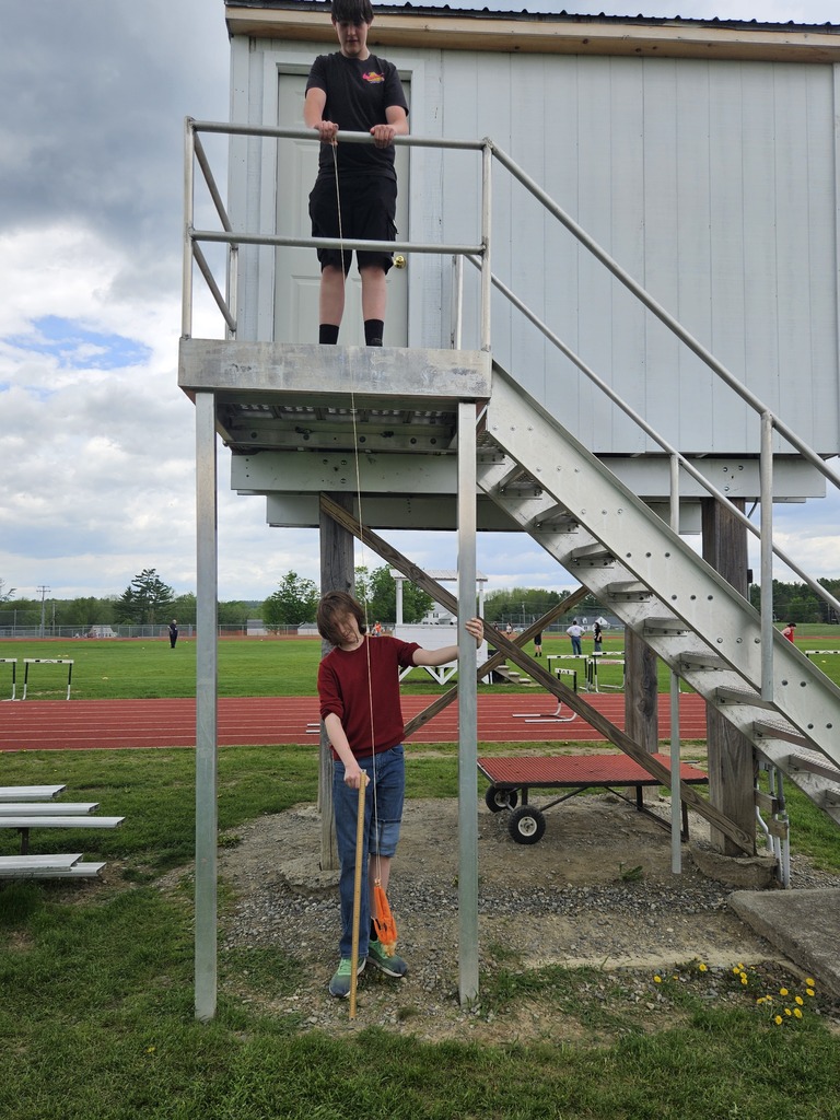 Students measuring a Barbie Bungee drop.